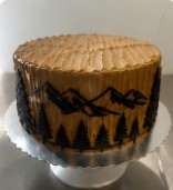 Mountain themed cake with 3D printed mountain and tree decorations